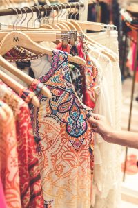 A woman looking at batik clothes on a rack - Darren Yaw Malaysia